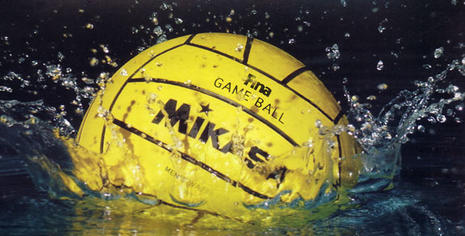 Water polo ball making a splash in water